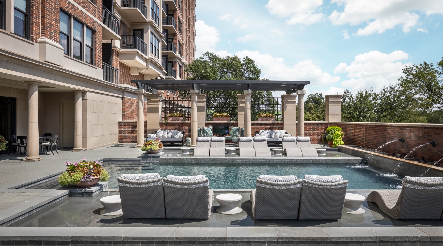 Resort-style swimming pool with lounge seating