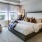 Large bedroom features two large windows