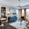 Spacioius living room features built-in bookshelves and plenty of large windows