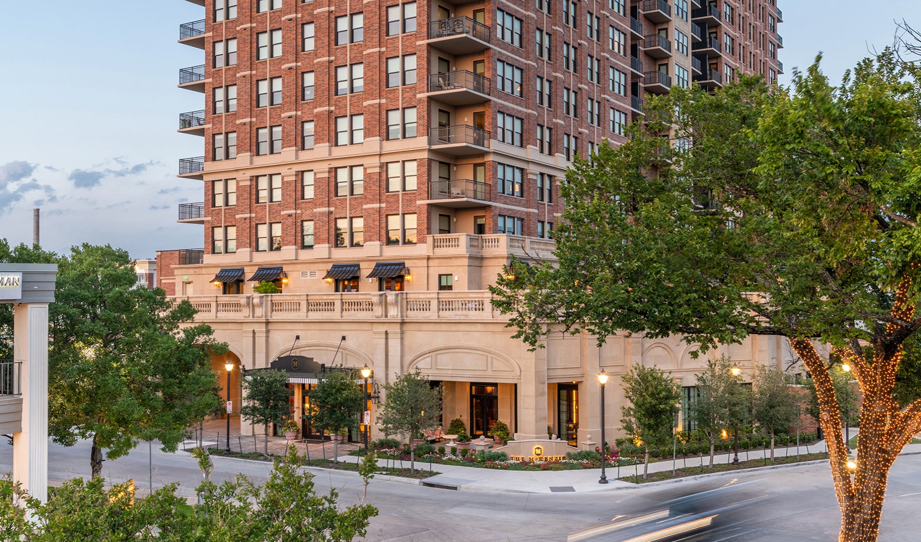 The exterior of The McKenzie shows a high-rise apartment complex