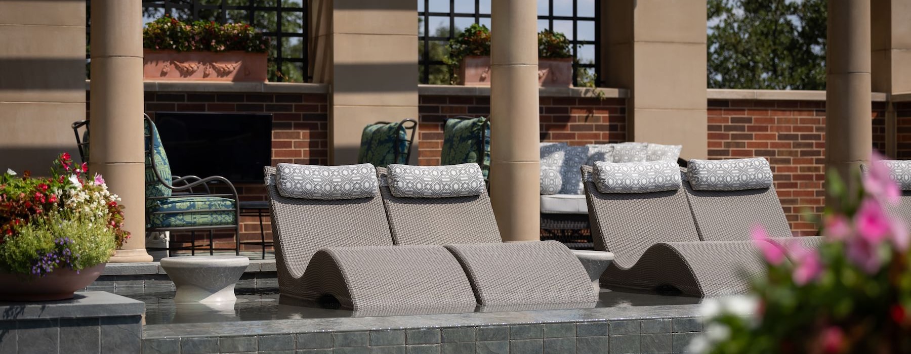 a swimming pool with sunbeds